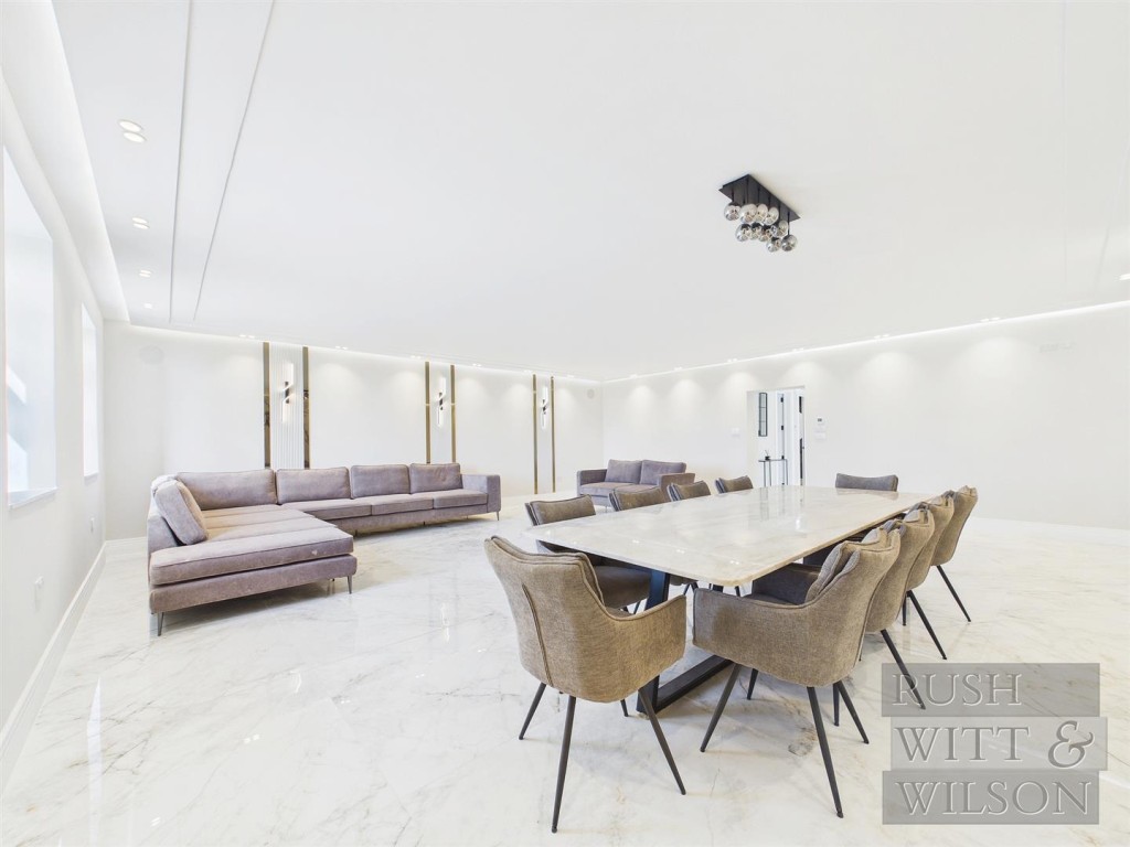 Lot: 100 - WELL PRESENTED DETACHED HOUSE - Living and dining room from another angle